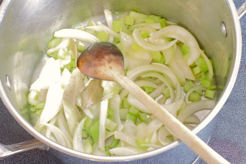 onions, celery, herbs, and garlic sauteing in oil