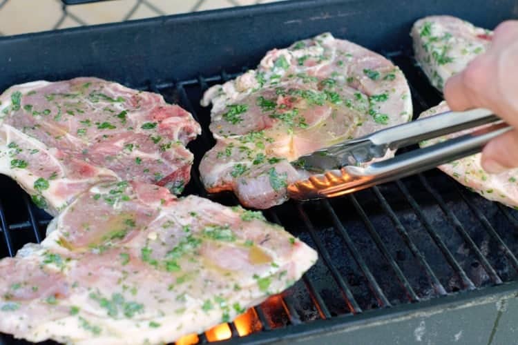 bone in pork chops on a bbq grill