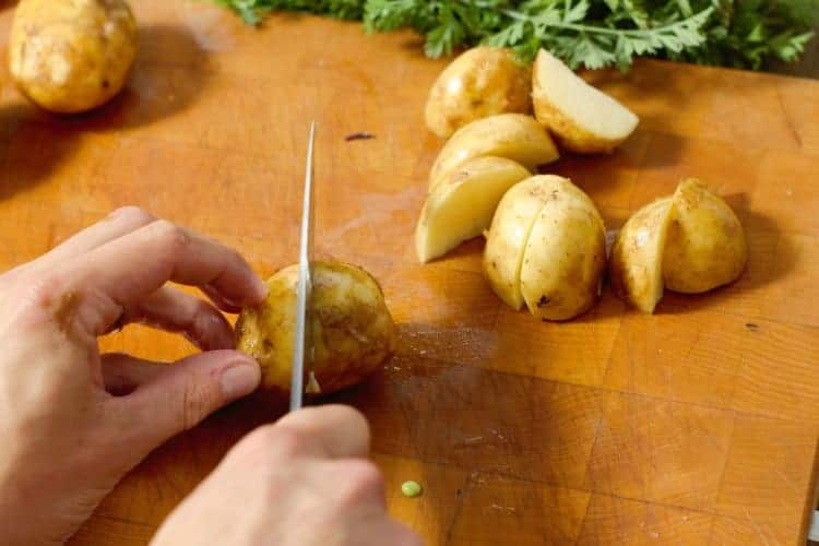 cutting new potatoes into quarters