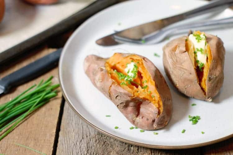 whole baked sweet potatoes served as a side dish