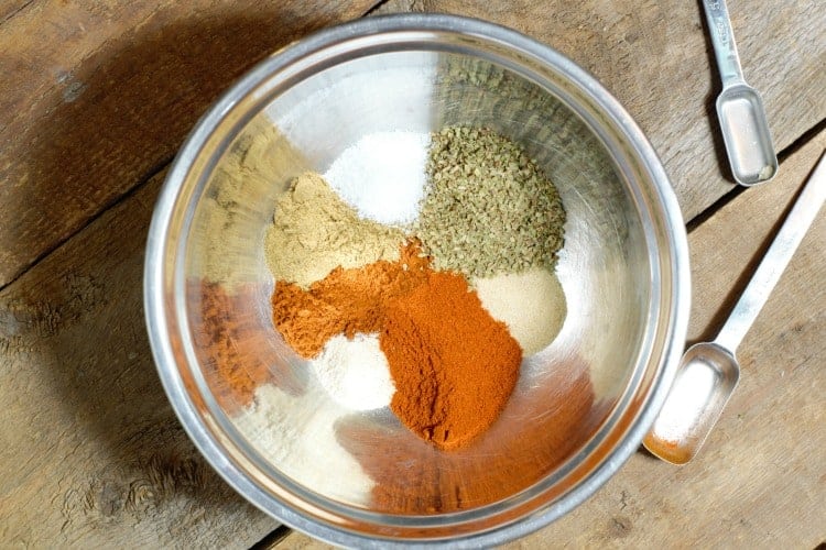 fajita spices in a metal bowl prior to mixing