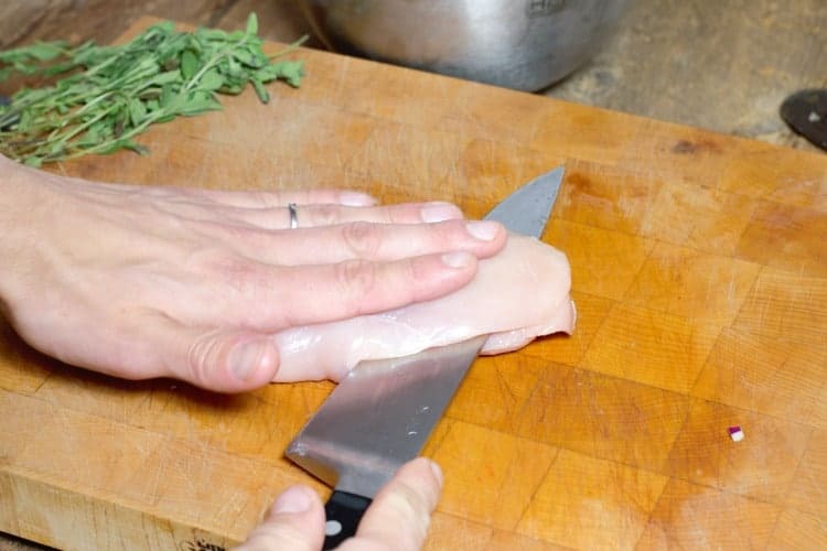 slicing a chicken breast in half horizontally