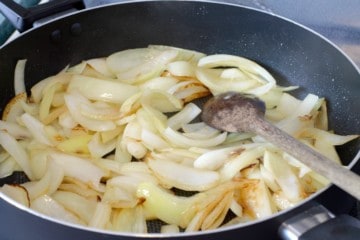 onions starting to cook in a pan