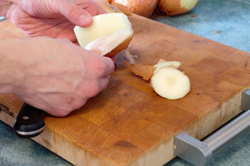peeling the skin off an onion