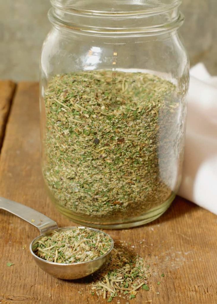 homemade italian seasoning stores in a glass mason jar