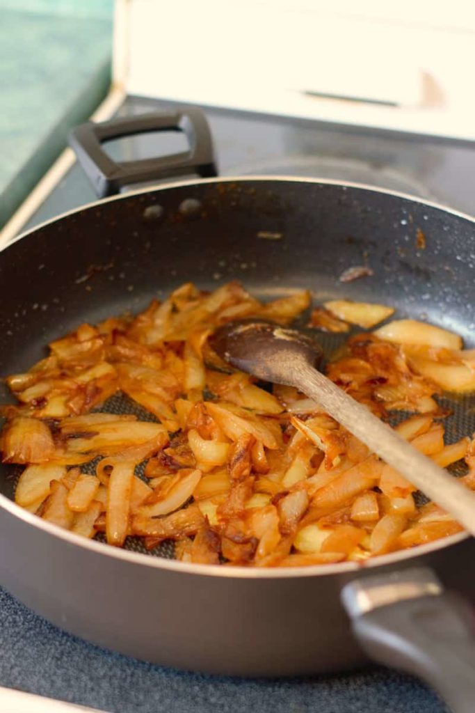 c=vertical image of caramelized onions in a pan