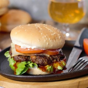 wild moose meat burger on a cast iron serving plate