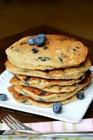 blueberry sourdough pancakes in a stack