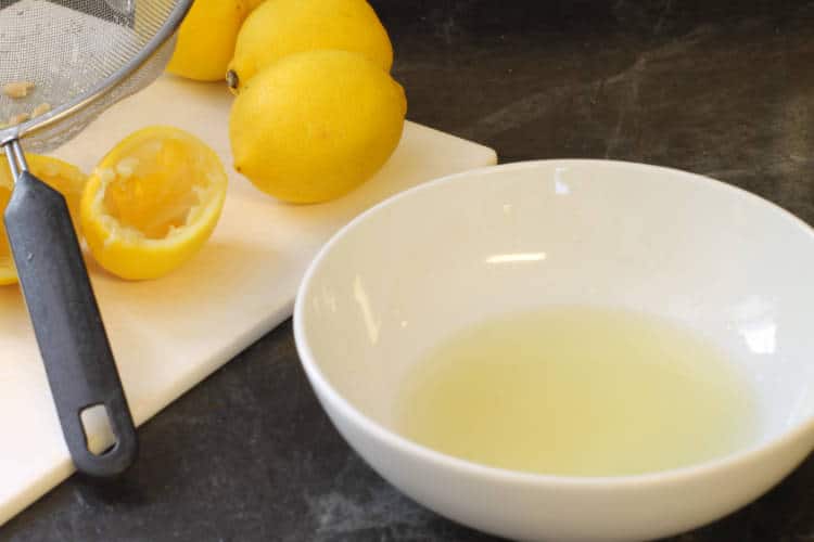 fresh squeezed lemon juice in a white bowl