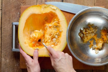 removing pumpkin seeds and guts before roasting