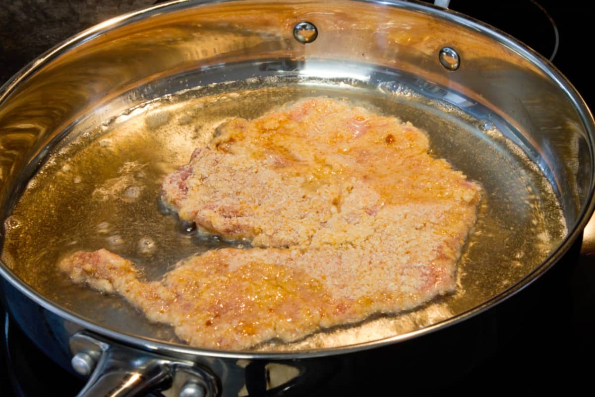 image showing how a pork schnitzel should be 'swimming' in oil in a pan while frying