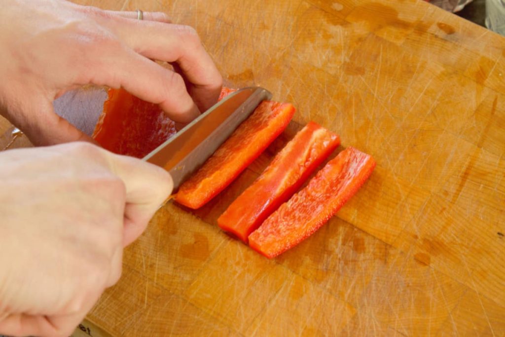 cutting the bell pepper into strips