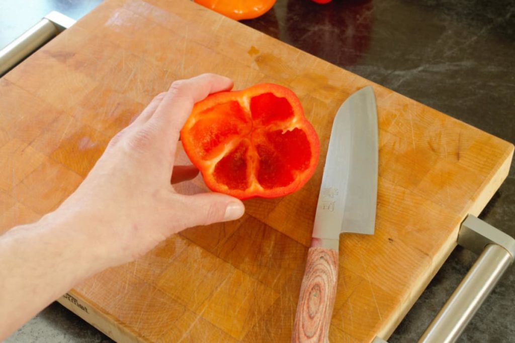 a hollowed out red bell pepper, ready to be stuffed