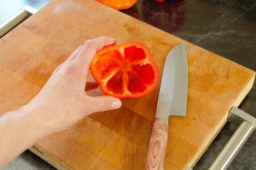 a hollowed out red bell pepper, ready to be stuffed