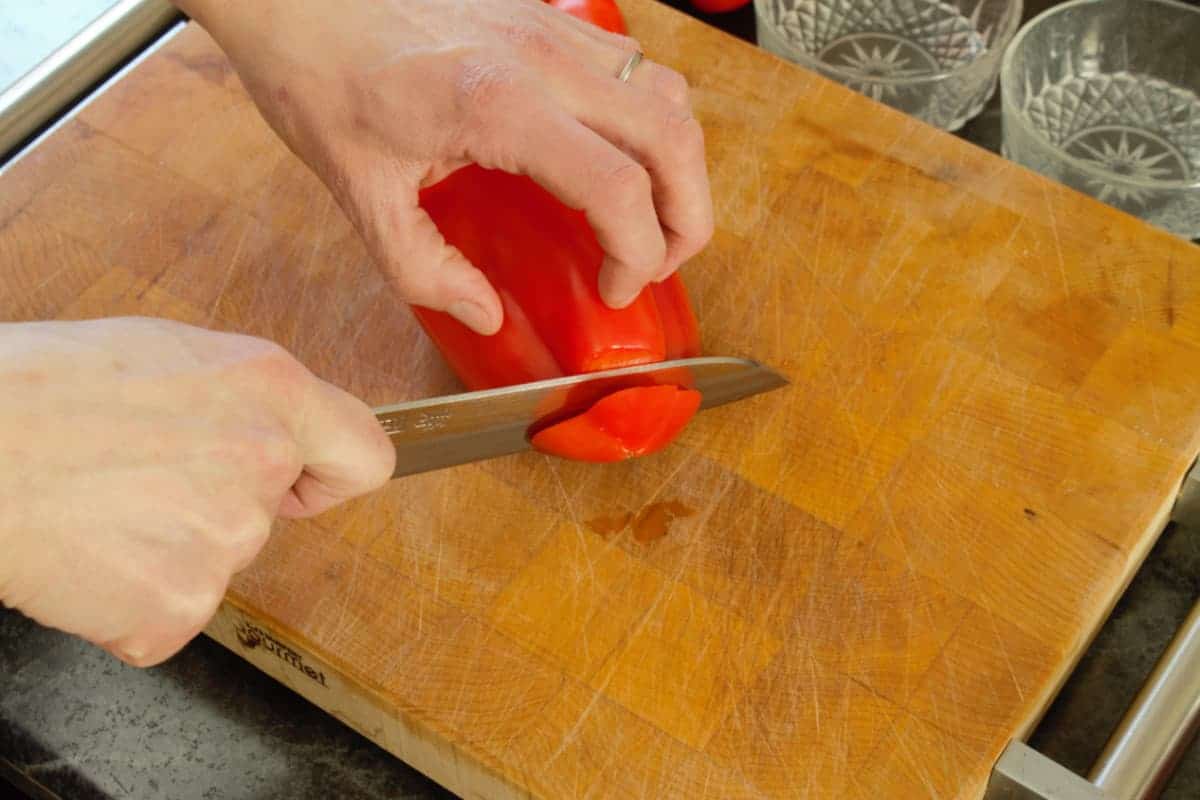 cutting around the core of a bell pepper