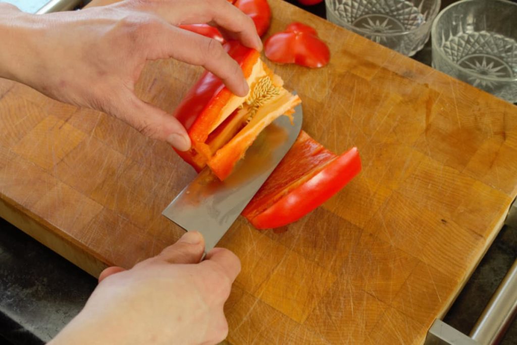 a close up of a red bell pepper julienne cut