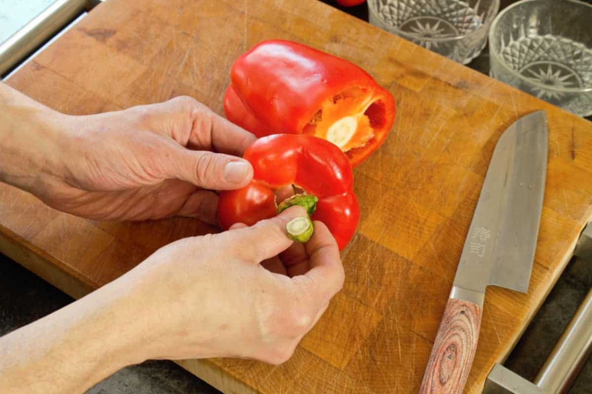 cutting into the side of a bell pepper