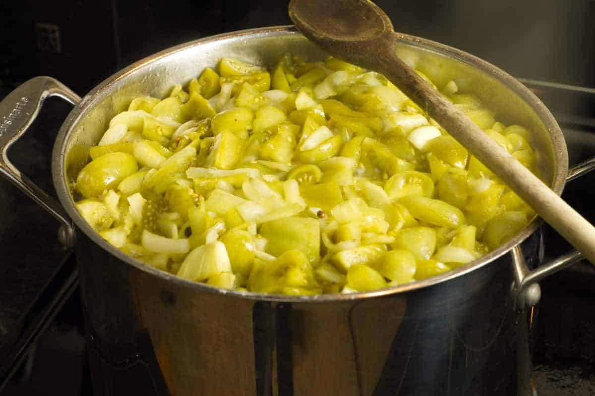 green tomato chow halfway into the cooking process in a steel pot
