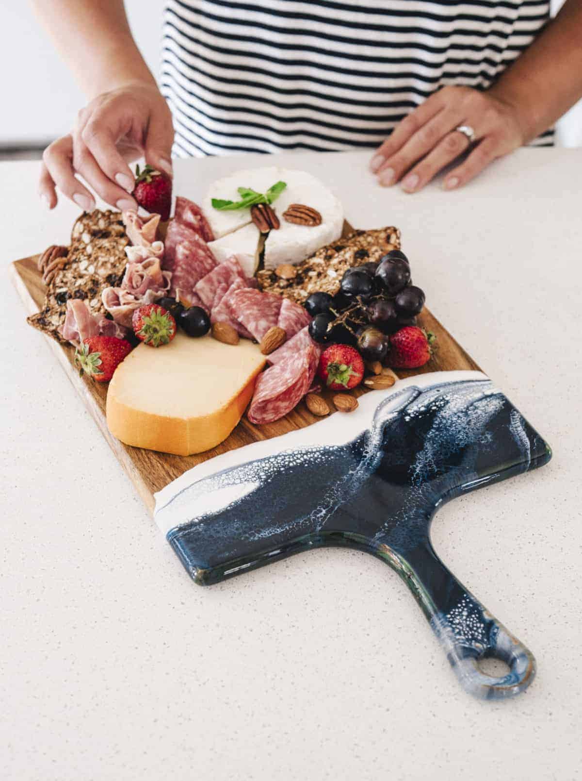 a hand crafted charcuterie board by Lynne & Liana Design
