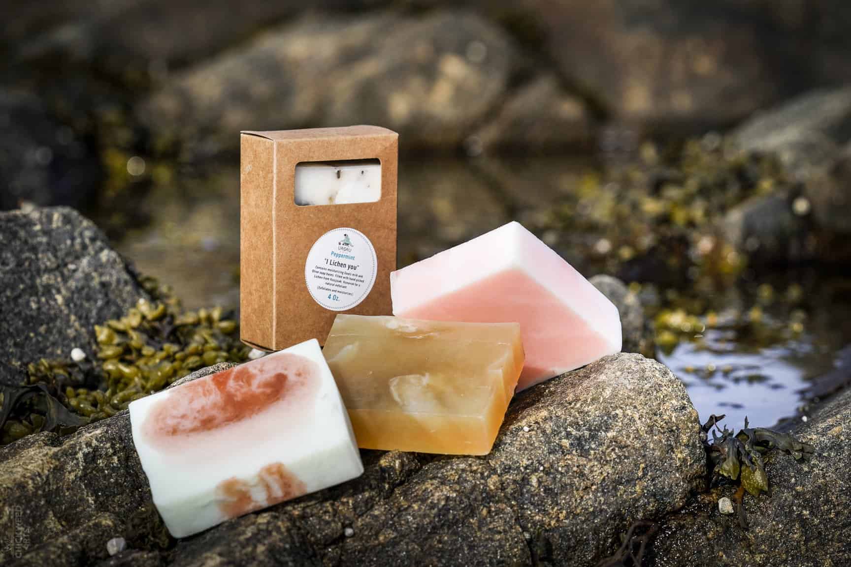 uasau brand soap bars displayed in a natural outdoor setting