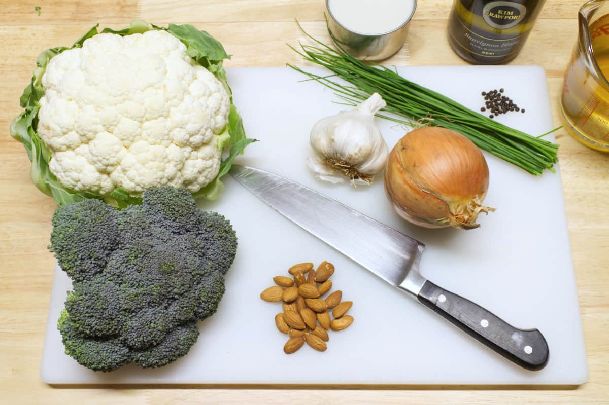 An overhead view of the different ingredients needed to create broccoli and cauliflower soup.