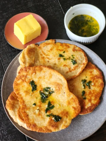 Homemade Naan Without Yeast with butter, garlic and coriander topping