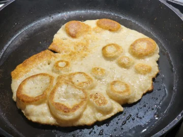 Fry for Homemade Naan Without Yeast on second side