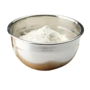 stainless steel mixing bowl with flour