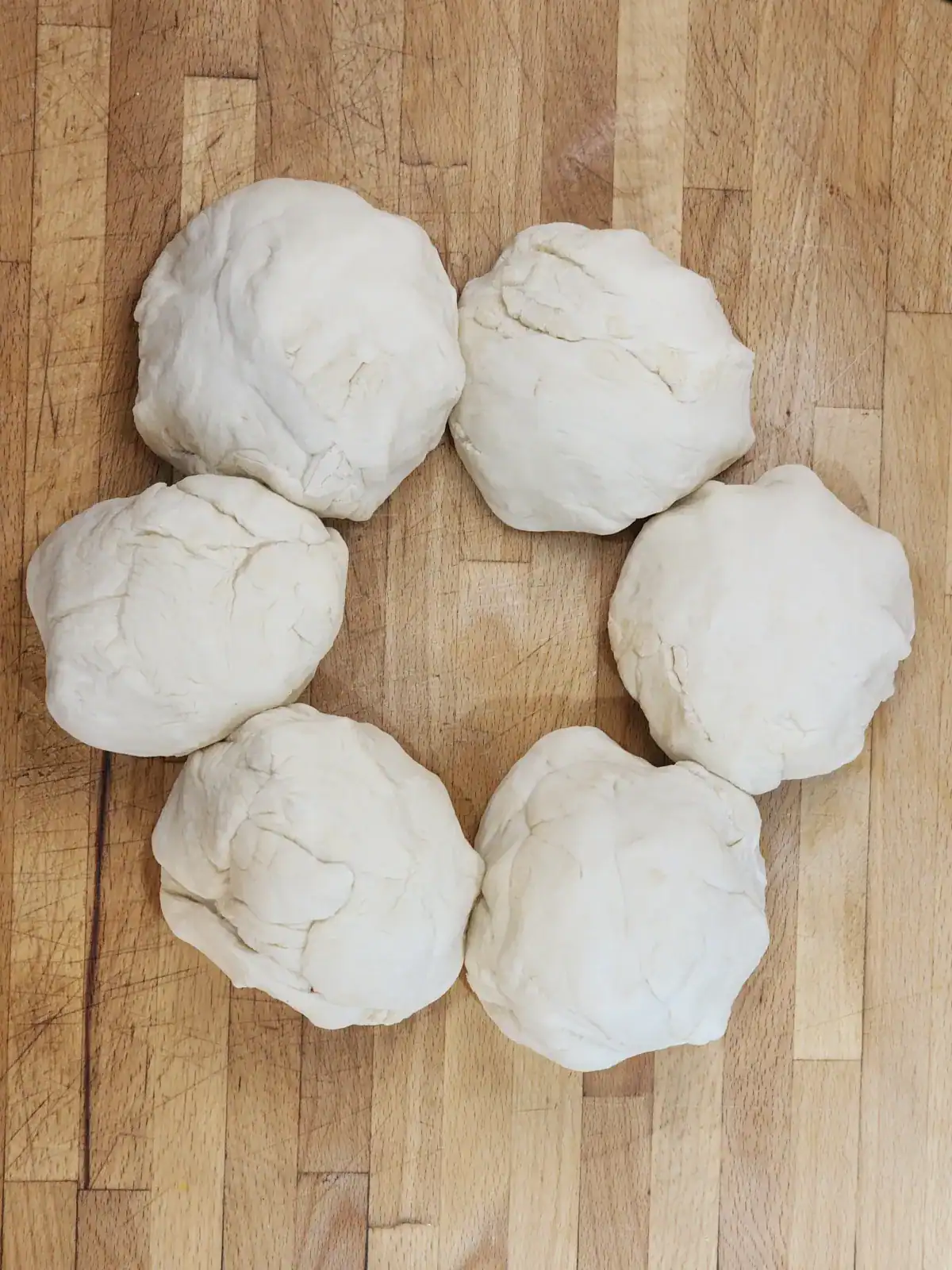 Homemade pizza dough divided to 6 pieces