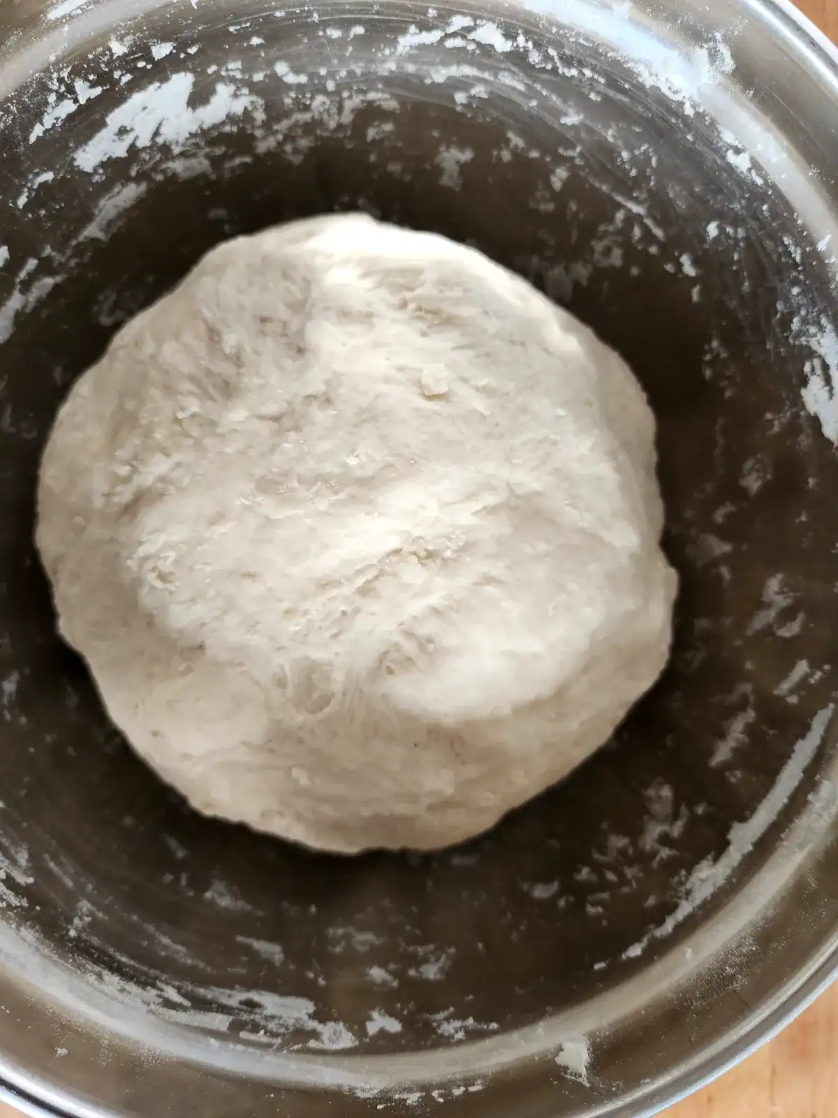 Homemade pizza dough ingredients combined in to the ball.