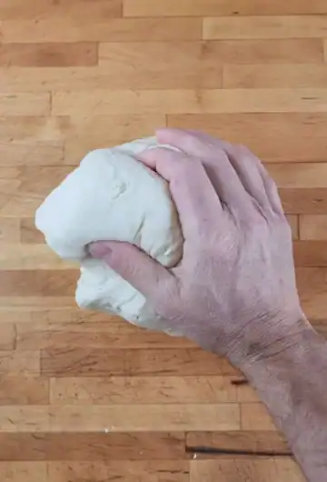 Kneading homemade pizza dough