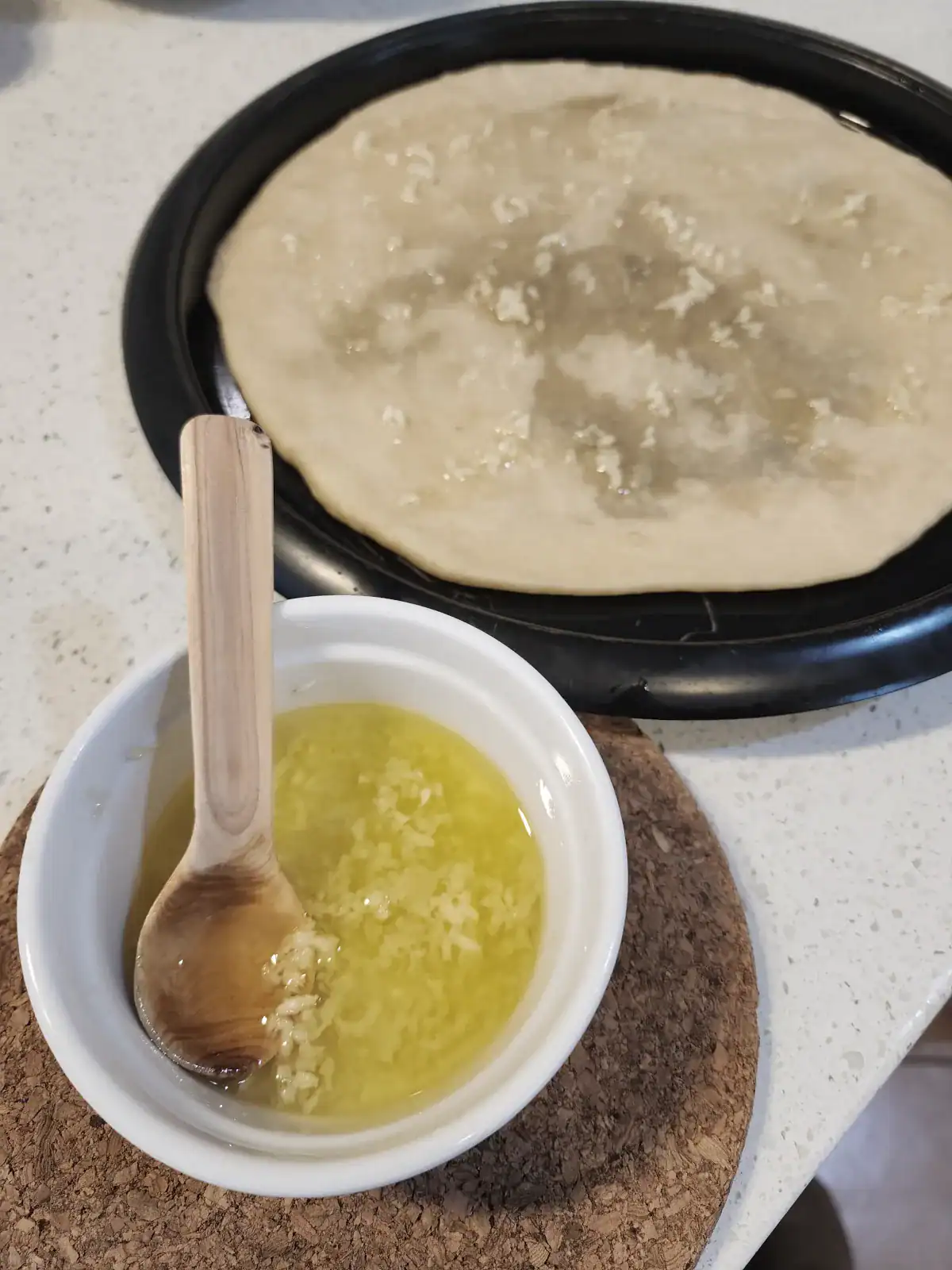 Pizza toppings - garlic, oil and salt mixture in the small ball