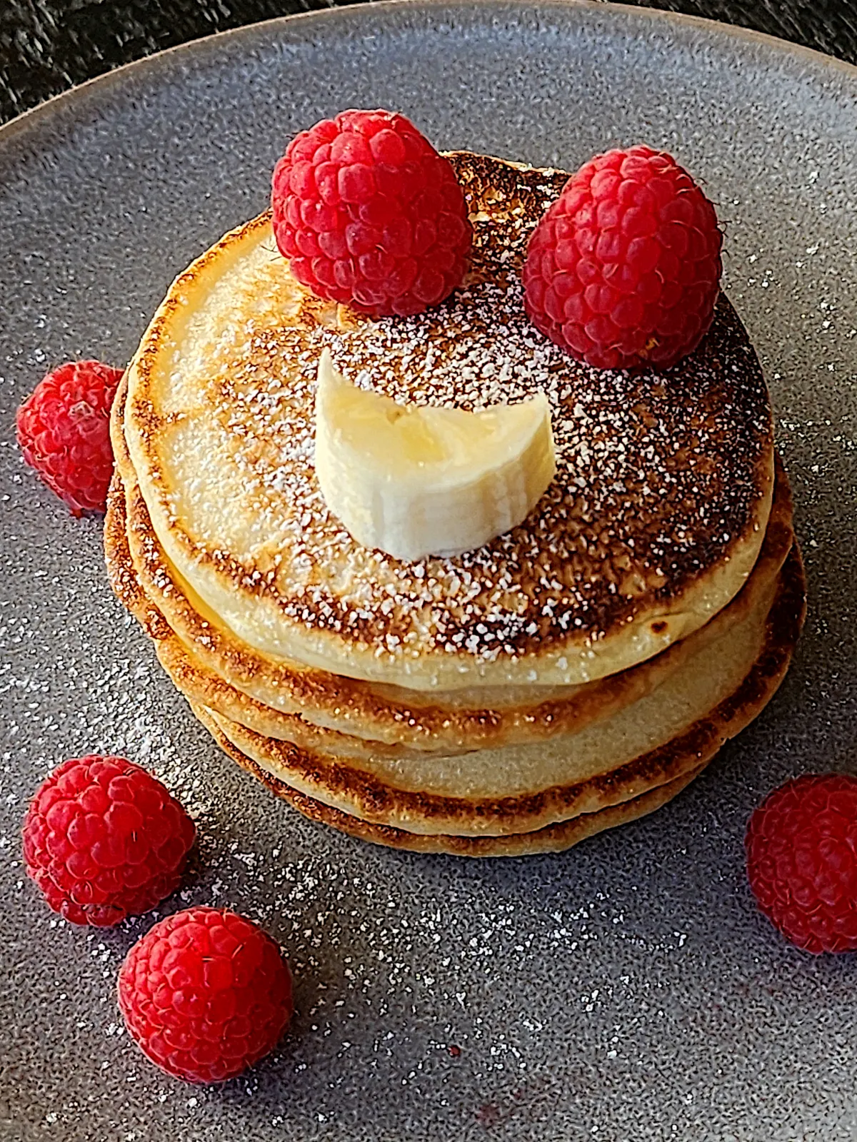 Medium size mini pancakes with raspberries and banana
