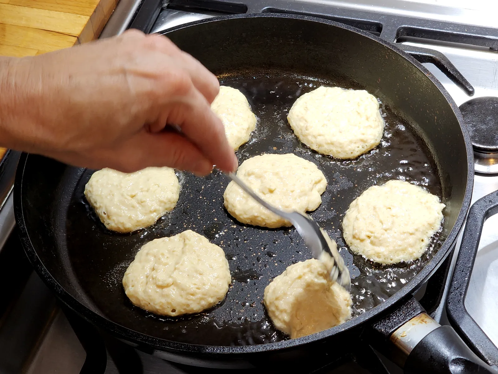 Frying mini pancakes - first side
