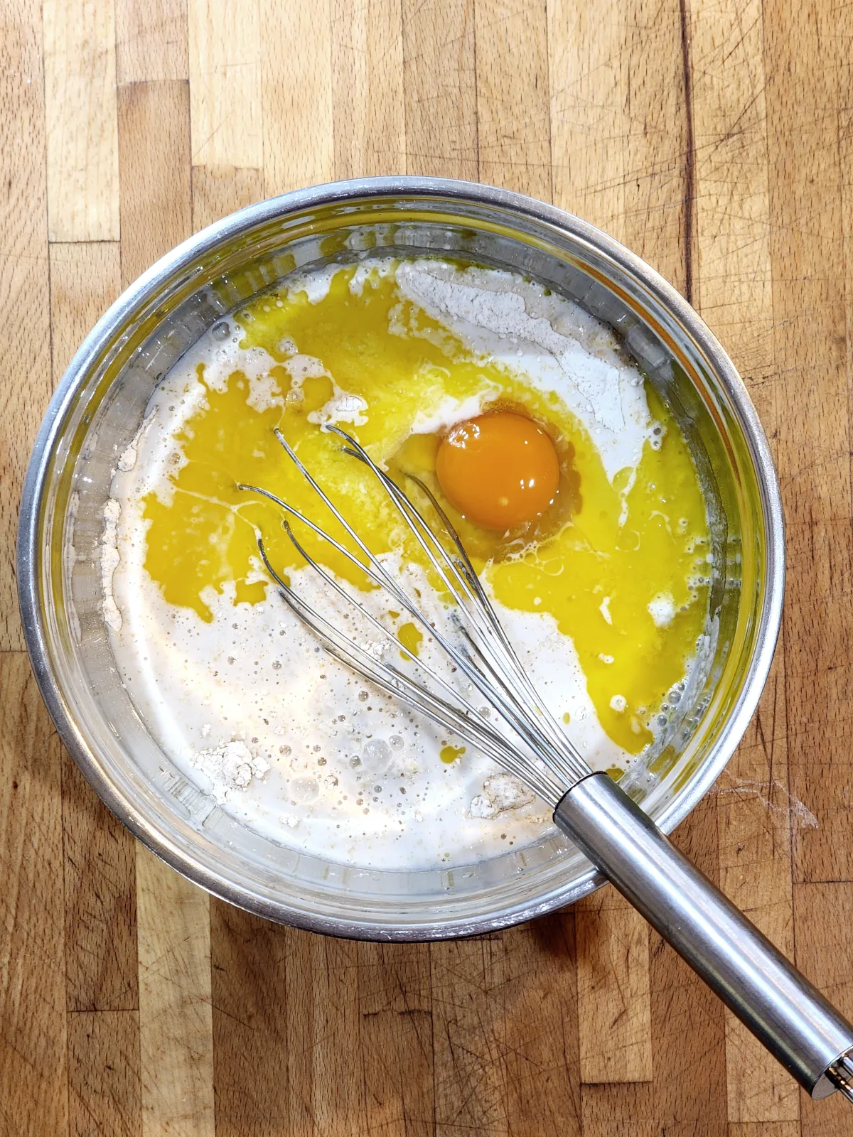 Mixing wet ingredients for mini pancakes