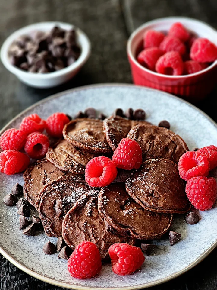 Chocolate Mini Pancakes with raspberries and chocolate chips