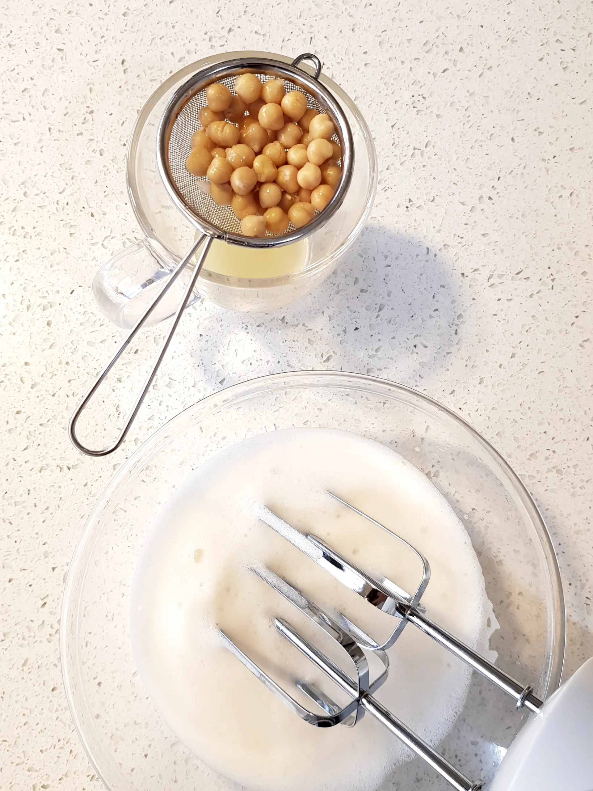 Whipped Aquafaba (the liquid from canned chickpeas) - vegan substitutes for eggs