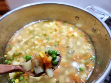 Add peas and corn to make a homemade potato soup (gluten-free)