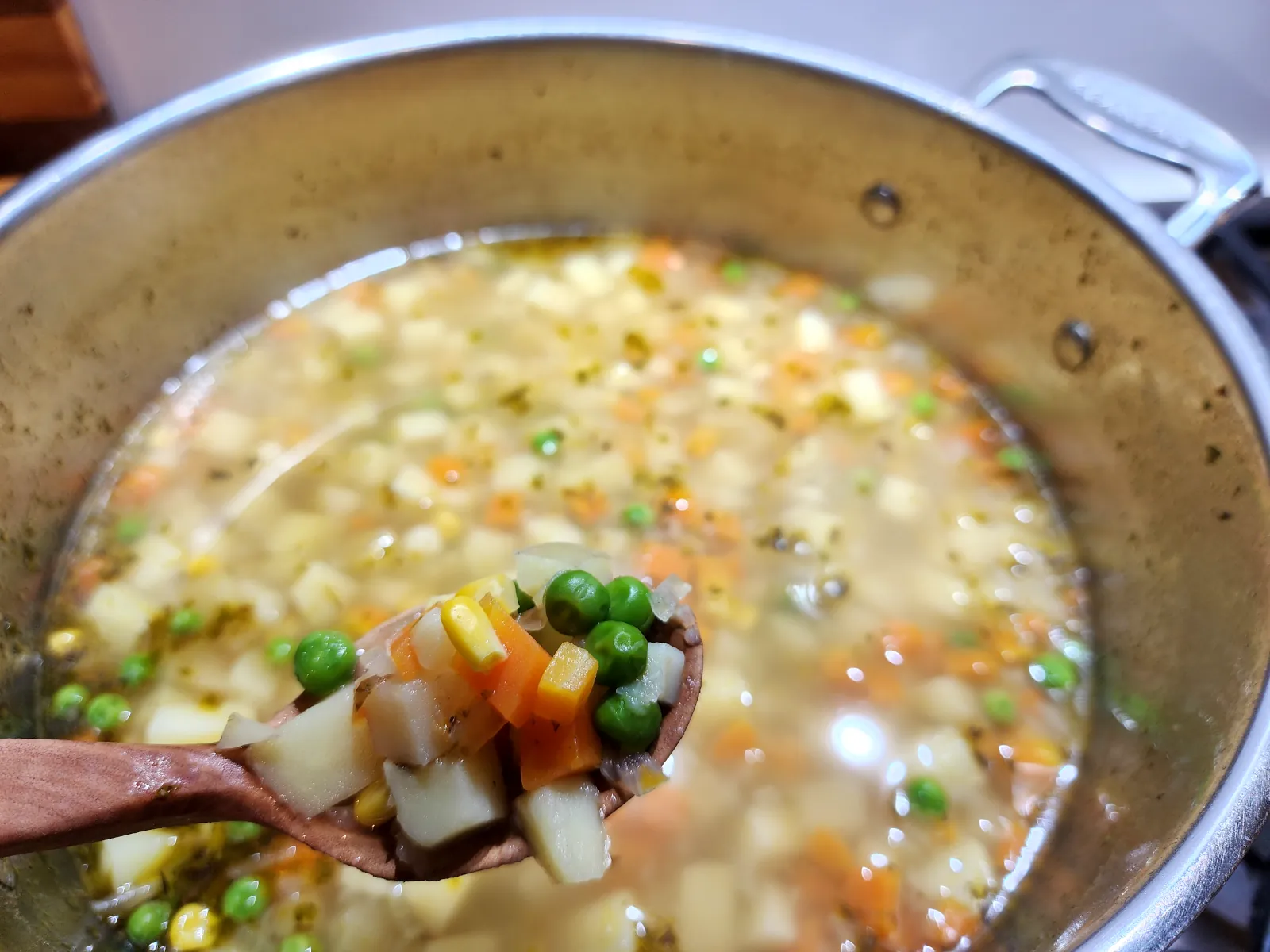 Add peas and corn to make a homemade potato soup (gluten-free)