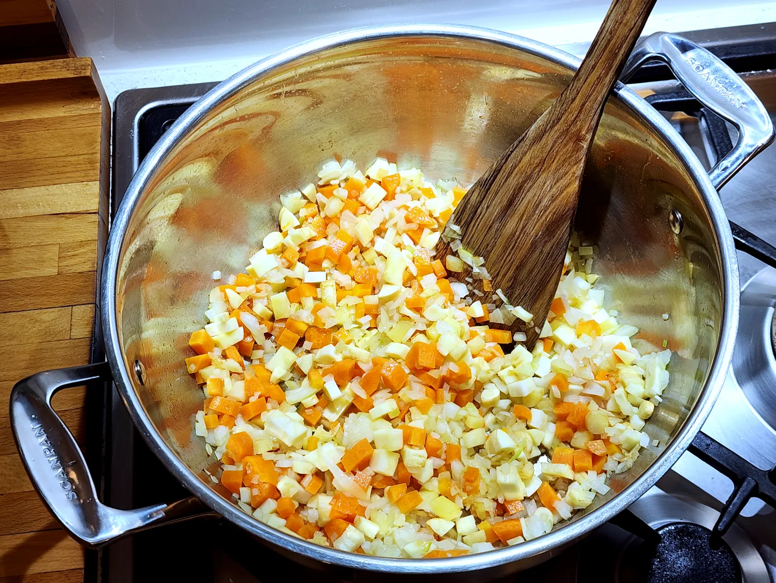 Sautéing onions, carrots, and parsnip for gluten-free homemade potato soup