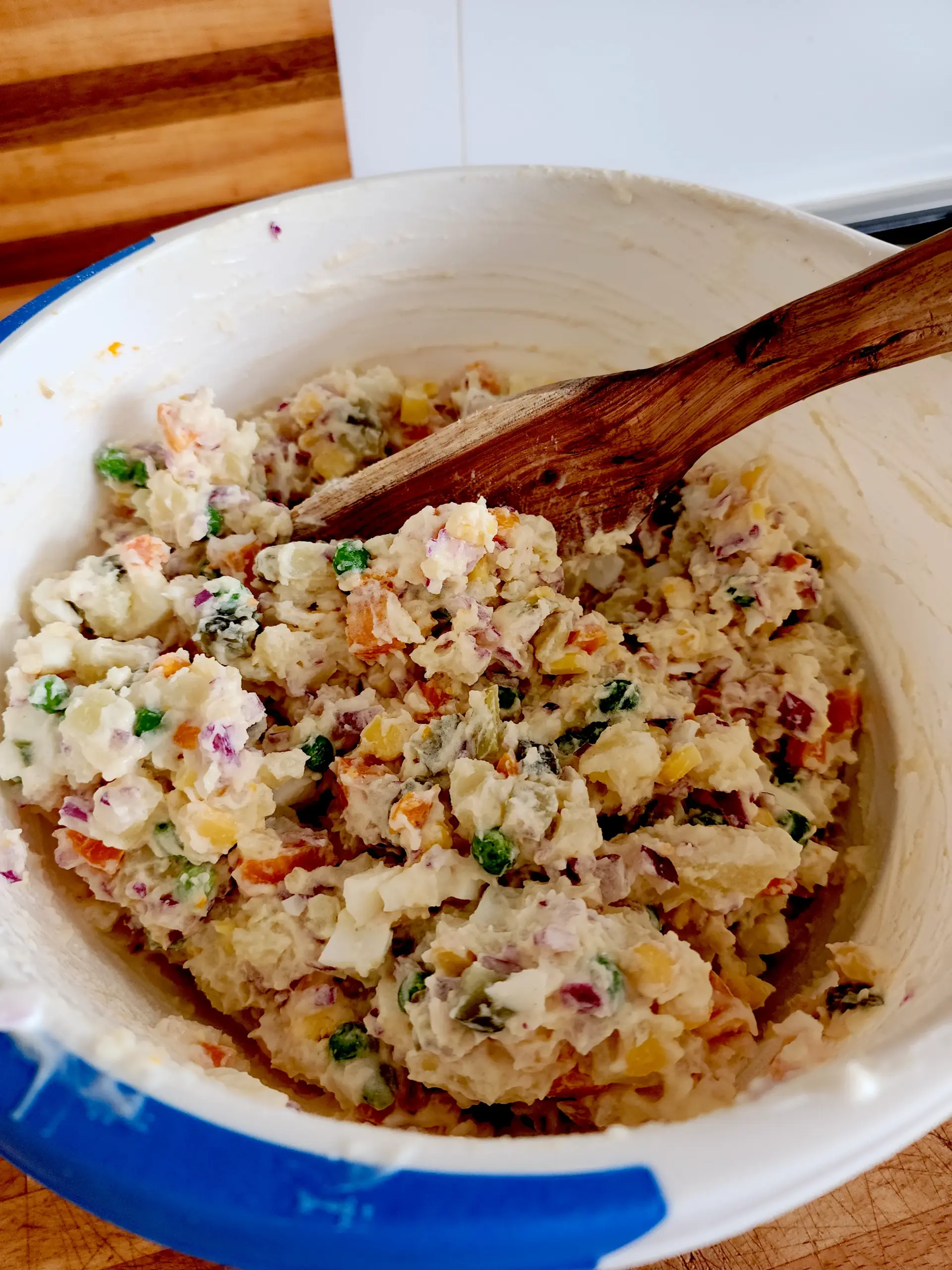 All ingredients for potato salad mixed together