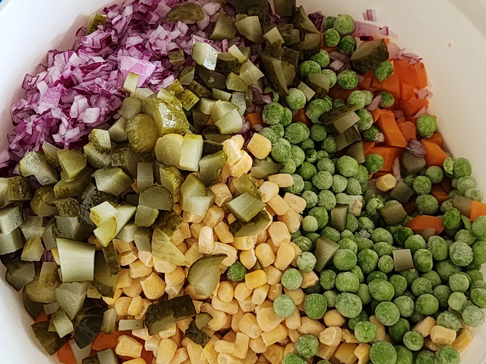 Vegetable mix for potato salad in a bowl.