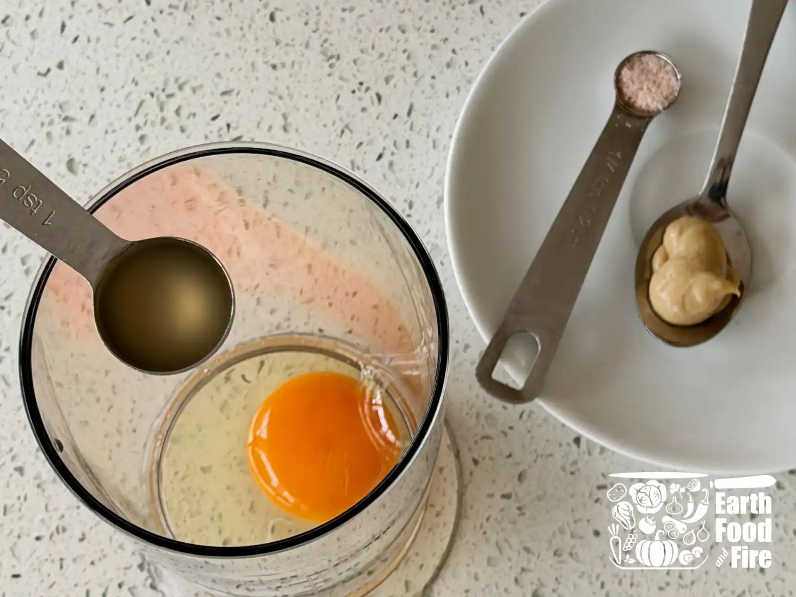 Adding mustard, vinegar, lemon juice, and salt on top of the egg.