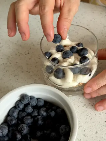 Adding layer of blueberries on top of the filling