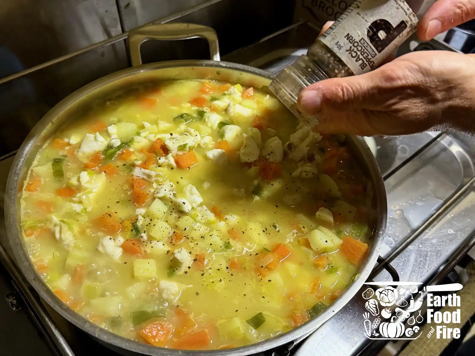 Adding pepper to the finished chowder