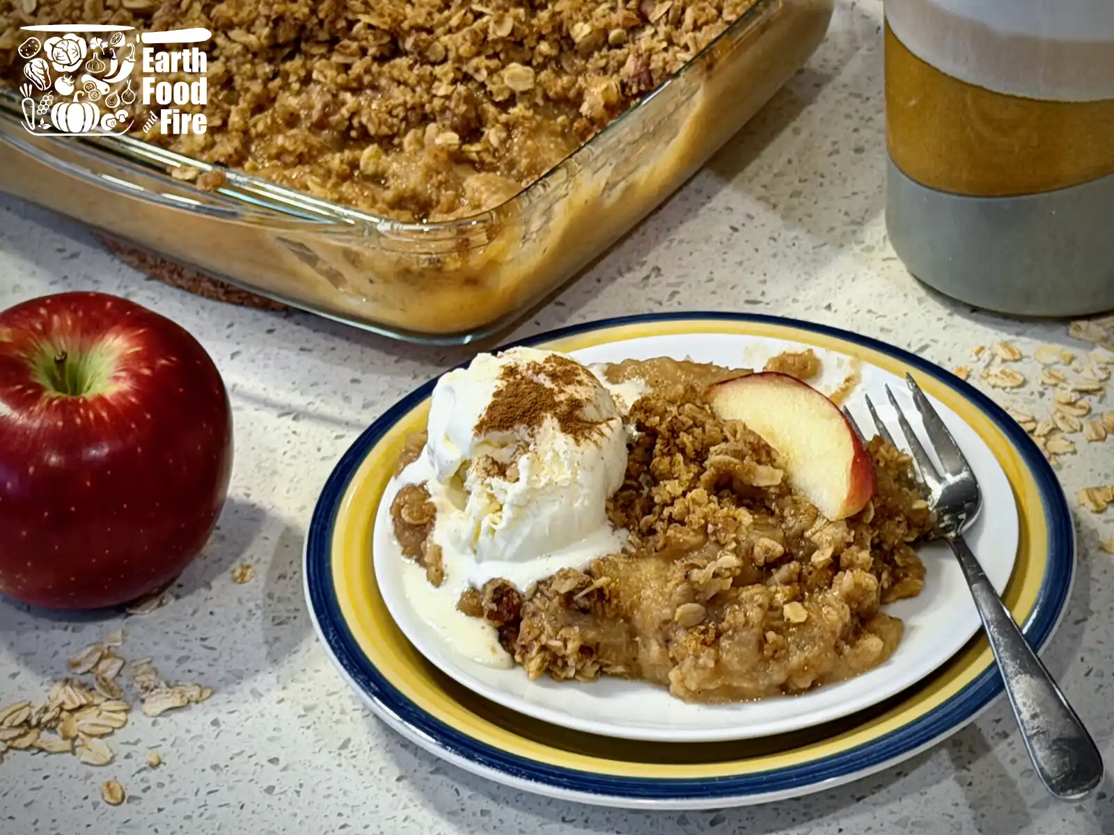 Applesauce crisp served with ice cream on a plate