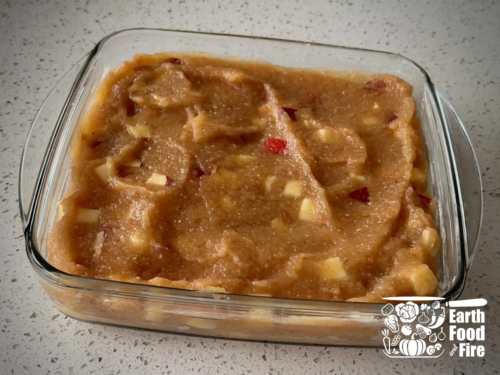 Chunky applesauce crisp filling in the baking dish