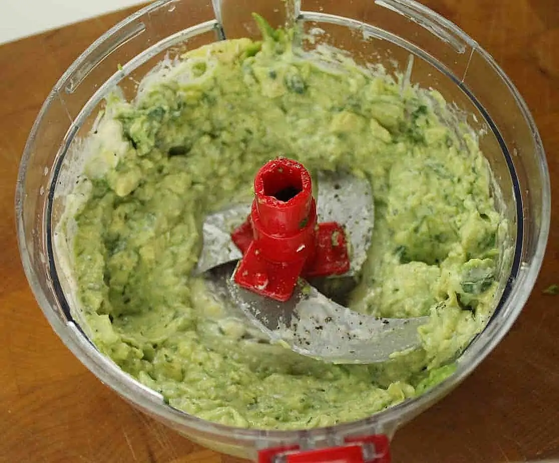 Detail of homemade cilantro and avocado mayonnaise in a blender