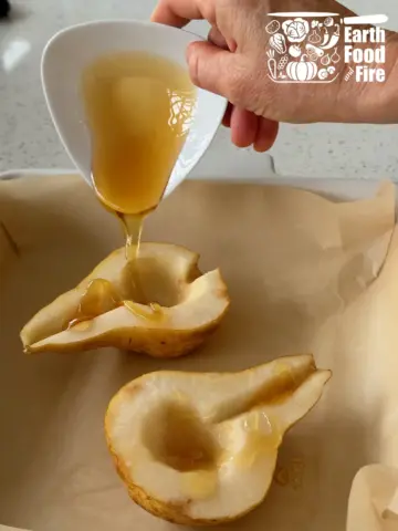 Honey drizzled into the cored wells of the pear halves