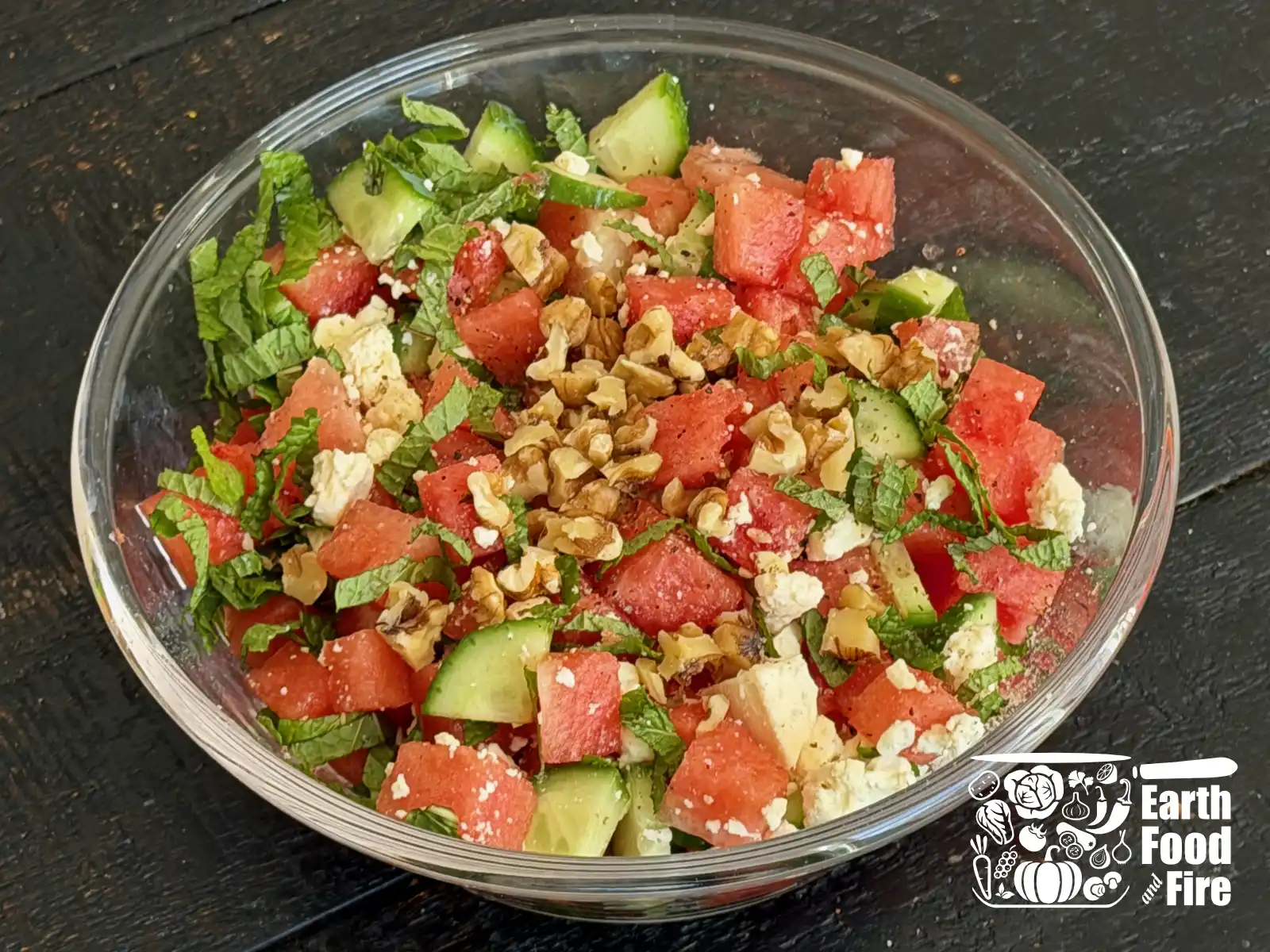 Finely chopped feta cheese and watermelon salad in a glass bowl